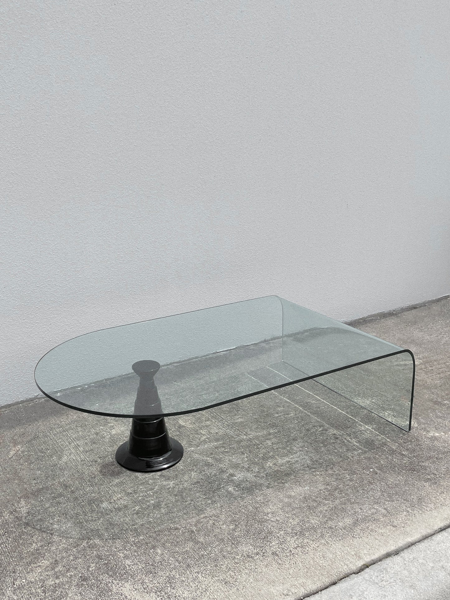 1980s Italian Waterfall Glass Coffee Table w/ Glossy Black Ceramic Pedestal